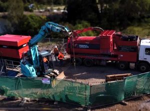 Rileys Creek Pezzimenti Vacuum Truck and loading rods via excavator