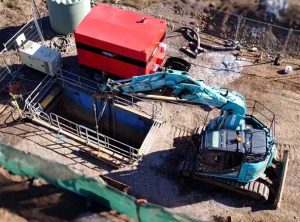 Rileys Creek Pezzimenti excavator craning rods into shaft